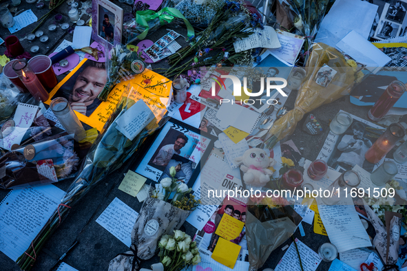 Flowers and cards are left at a memorial dedicated to former One Direction singer Liam Payne at Washington Square Park in New York, New York...