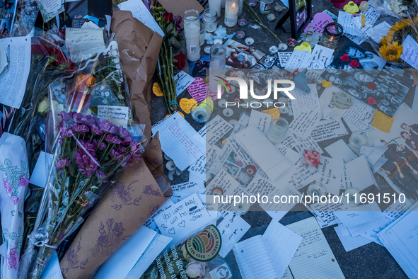 Flowers and cards are left at a memorial dedicated to former One Direction singer Liam Payne at Washington Square Park in New York, New York...