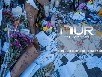 Flowers and cards are left at a memorial dedicated to former One Direction singer Liam Payne at Washington Square Park in New York, New York...