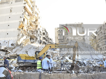 A view of the destruction after the Israeli army targets Bank Kared Al Hassan with a series of airstrikes on the suburb of Dahieh, as debris...