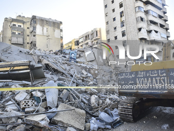 A view of the destruction after the Israeli army targets Bank Kared Al Hassan with a series of airstrikes on the suburb of Dahieh, as debris...