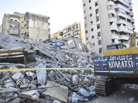 A view of the destruction after the Israeli army targets Bank Kared Al Hassan with a series of airstrikes on the suburb of Dahieh, as debris...