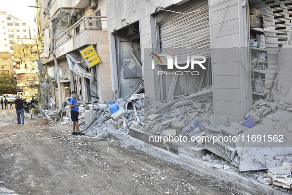 A view of the destruction after the Israeli army targets Bank Kared Al Hassan with a series of airstrikes on the suburb of Dahieh, as debris...