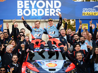 Driver Ott Tanak and co-driver Martin Jarveoja are in a family photo at the final podium during the FIA World Rally Championship WRC Central...