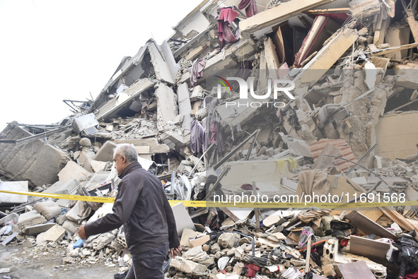 A view of the destruction after the Israeli army targets Bank Kared Al Hassan with a series of airstrikes on the suburb of Dahieh, as debris...