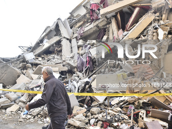 A view of the destruction after the Israeli army targets Bank Kared Al Hassan with a series of airstrikes on the suburb of Dahieh, as debris...