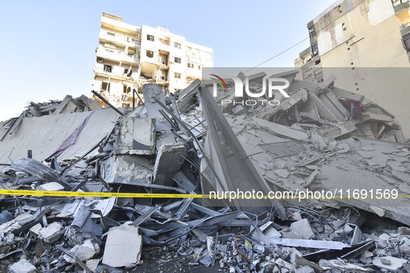 A view of the destruction after the Israeli army targets Bank Kared Al Hassan with a series of airstrikes on the suburb of Dahieh, as debris...