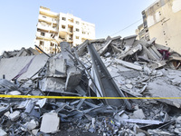 A view of the destruction after the Israeli army targets Bank Kared Al Hassan with a series of airstrikes on the suburb of Dahieh, as debris...