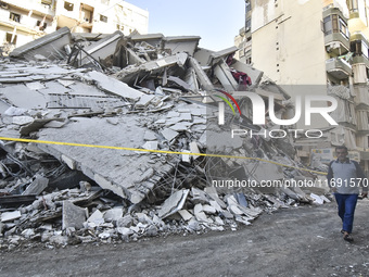 A view of the destruction after the Israeli army targets Bank Kared Al Hassan with a series of airstrikes on the suburb of Dahieh, as debris...