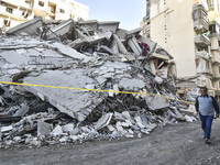 A view of the destruction after the Israeli army targets Bank Kared Al Hassan with a series of airstrikes on the suburb of Dahieh, as debris...