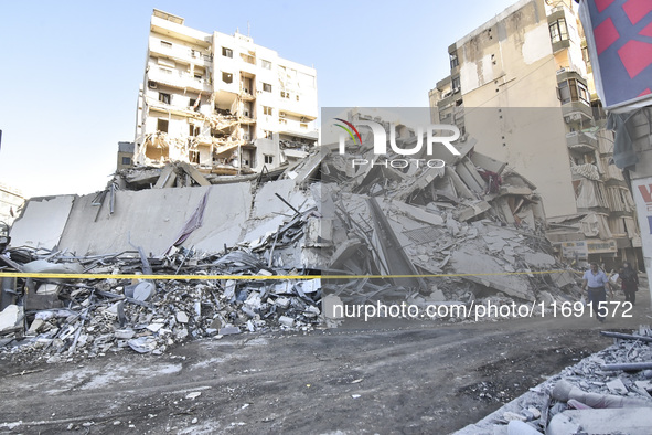 A view of the destruction after the Israeli army targets Bank Kared Al Hassan with a series of airstrikes on the suburb of Dahieh, as debris...