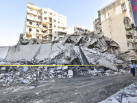 A view of the destruction after the Israeli army targets Bank Kared Al Hassan with a series of airstrikes on the suburb of Dahieh, as debris...