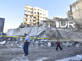 A view of the destruction after the Israeli army targets Bank Kared Al Hassan with a series of airstrikes on the suburb of Dahieh, as debris...