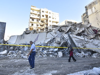 A view of the destruction after the Israeli army targets Bank Kared Al Hassan with a series of airstrikes on the suburb of Dahieh, as debris...