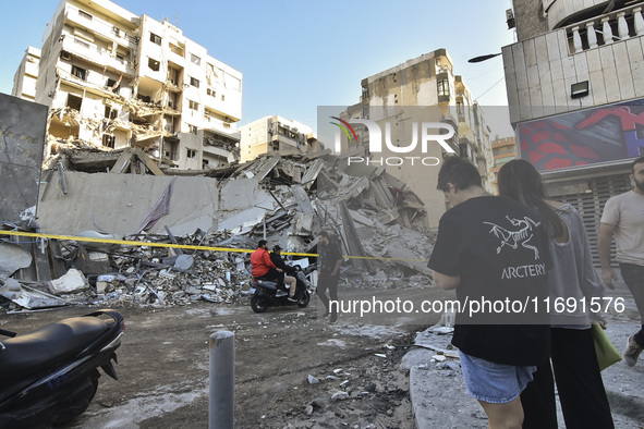 A view of the destruction after the Israeli army targets Bank Kared Al Hassan with a series of airstrikes on the suburb of Dahieh, as debris...