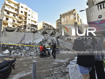 A view of the destruction after the Israeli army targets Bank Kared Al Hassan with a series of airstrikes on the suburb of Dahieh, as debris...