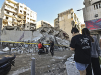 A view of the destruction after the Israeli army targets Bank Kared Al Hassan with a series of airstrikes on the suburb of Dahieh, as debris...