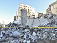 A view of the destruction after the Israeli army targets Bank Kared Al Hassan with a series of airstrikes on the suburb of Dahieh, as debris...