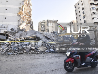 A view of the destruction after the Israeli army targets Bank Kared Al Hassan with a series of airstrikes on the suburb of Dahieh, as debris...