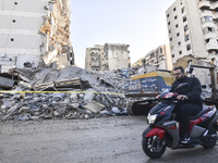 A view of the destruction after the Israeli army targets Bank Kared Al Hassan with a series of airstrikes on the suburb of Dahieh, as debris...