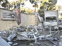 A view of the destruction after the Israeli army targets Bank Kared Al Hassan with a series of airstrikes on the suburb of Dahieh, as debris...