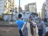 A view of the destruction after the Israeli army targets Bank Kared Al Hassan with a series of airstrikes on the suburb of Dahieh, as debris...