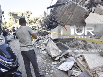 A view of the destruction after the Israeli army targets Bank Kared Al Hassan with a series of airstrikes on the suburb of Dahieh, as debris...