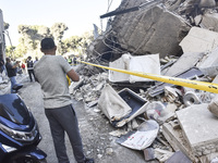 A view of the destruction after the Israeli army targets Bank Kared Al Hassan with a series of airstrikes on the suburb of Dahieh, as debris...