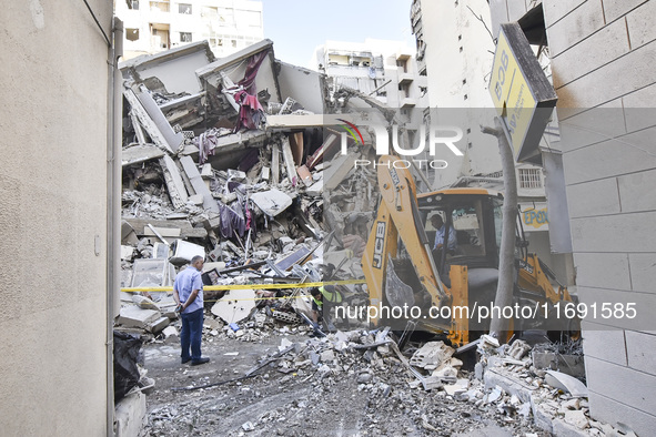 A view of the destruction after the Israeli army targets Bank Kared Al Hassan with a series of airstrikes on the suburb of Dahieh, as debris...