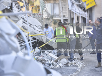 A view of the destruction after the Israeli army targets Bank Kared Al Hassan with a series of airstrikes on the suburb of Dahieh, as debris...