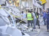 A view of the destruction after the Israeli army targets Bank Kared Al Hassan with a series of airstrikes on the suburb of Dahieh, as debris...