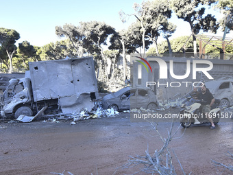 A view of the destruction after the Israeli army targets Bank Kared Al Hassan with a series of airstrikes on the suburb of Dahieh, as debris...