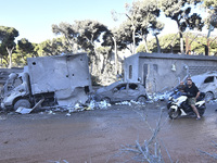 A view of the destruction after the Israeli army targets Bank Kared Al Hassan with a series of airstrikes on the suburb of Dahieh, as debris...