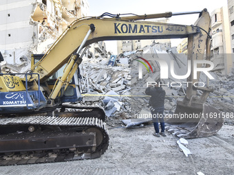 A view of the destruction after the Israeli army targets Bank Kared Al Hassan with a series of airstrikes on the suburb of Dahieh, as debris...