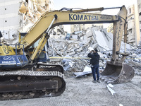 A view of the destruction after the Israeli army targets Bank Kared Al Hassan with a series of airstrikes on the suburb of Dahieh, as debris...