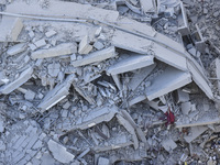 A view of the destruction after the Israeli army targets Bank Kared Al Hassan with a series of airstrikes on the suburb of Dahieh, as debris...