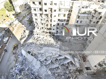 A view of the destruction after the Israeli army targets Bank Kared Al Hassan with a series of airstrikes on the suburb of Dahieh, as debris...