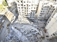 A view of the destruction after the Israeli army targets Bank Kared Al Hassan with a series of airstrikes on the suburb of Dahieh, as debris...