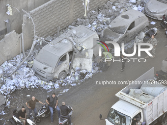 A view of the destruction after the Israeli army targets Bank Kared Al Hassan with a series of airstrikes on the suburb of Dahieh, as debris...