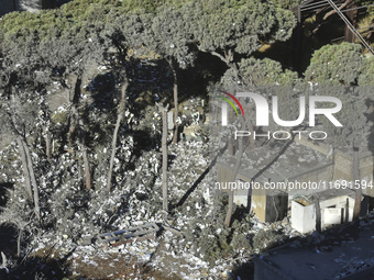 A view of the destruction after the Israeli army targets Bank Kared Al Hassan with a series of airstrikes on the suburb of Dahieh, as debris...