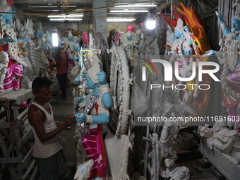 An artist paints an idol of the Hindu goddess Kali inside a workshop in Kolkata, India, on October 21, 2024. Diwali comes from the Sanskrit...