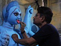 An artist paints an idol of the Hindu goddess Kali inside a workshop in Kolkata, India, on October 21, 2024. Diwali comes from the Sanskrit...