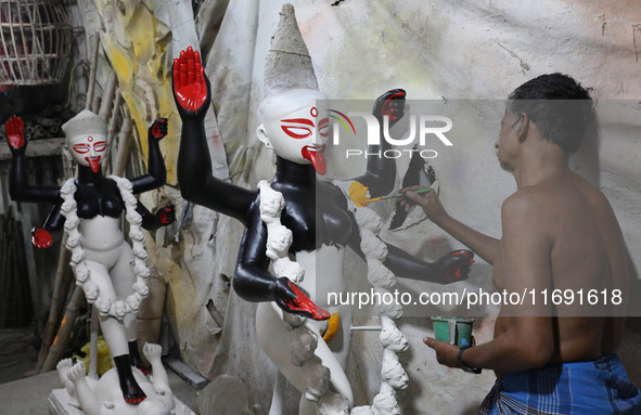 An artist paints an idol of the Hindu goddess Kali inside a workshop in Kolkata, India, on October 21, 2024. Diwali comes from the Sanskrit...