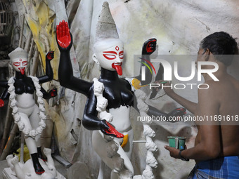 An artist paints an idol of the Hindu goddess Kali inside a workshop in Kolkata, India, on October 21, 2024. Diwali comes from the Sanskrit...