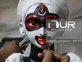 An artist paints an idol of the Hindu goddess Kali inside a workshop in Kolkata, India, on October 21, 2024. Diwali comes from the Sanskrit...