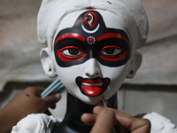 An artist paints an idol of the Hindu goddess Kali inside a workshop in Kolkata, India, on October 21, 2024. Diwali comes from the Sanskrit...