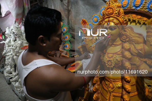 An artist paints an idol of the Hindu goddess Kali inside a workshop in Kolkata, India, on October 21, 2024. Diwali comes from the Sanskrit...