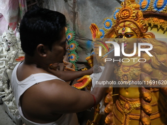 An artist paints an idol of the Hindu goddess Kali inside a workshop in Kolkata, India, on October 21, 2024. Diwali comes from the Sanskrit...