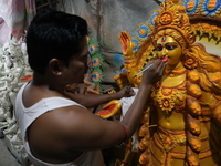 An artist paints an idol of the Hindu goddess Kali inside a workshop in Kolkata, India, on October 21, 2024. Diwali comes from the Sanskrit...