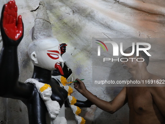 An artist paints an idol of the Hindu goddess Kali inside a workshop in Kolkata, India, on October 21, 2024. Diwali comes from the Sanskrit...